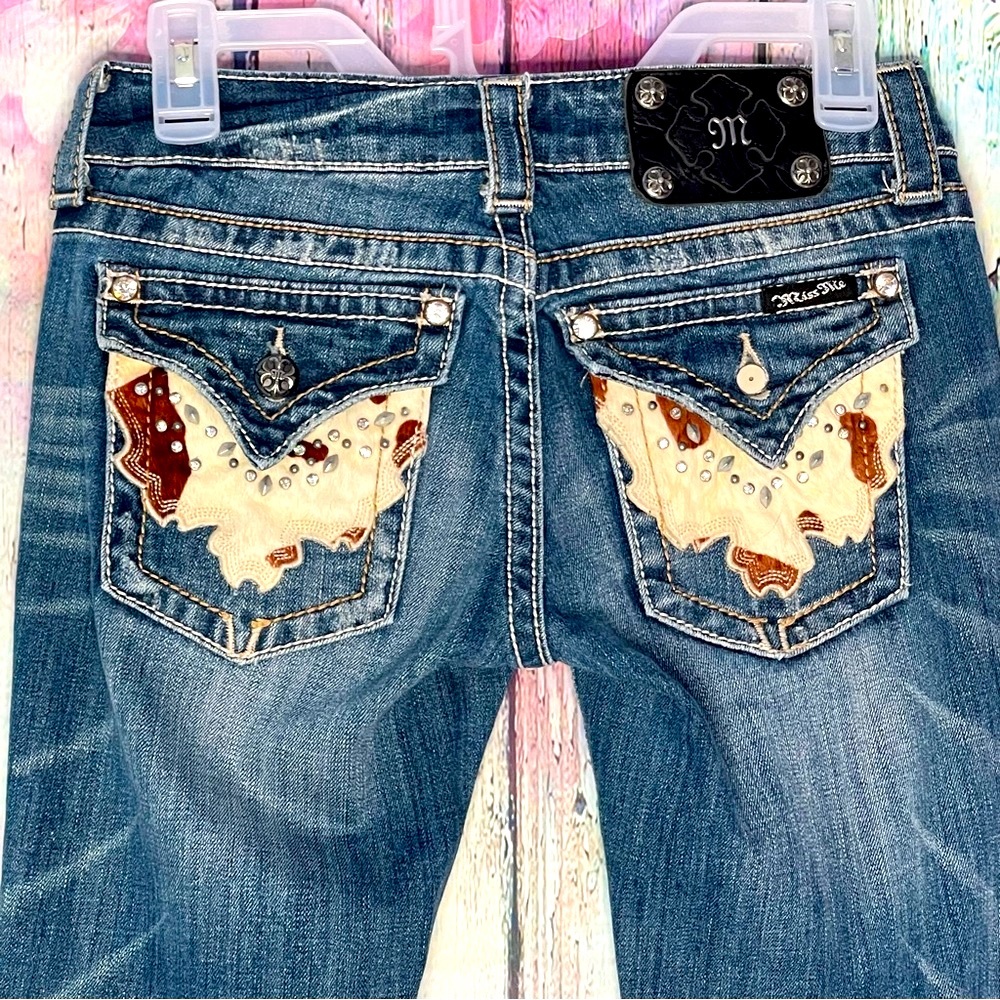 Cow Print on back pocket,  Miss Me Jeans